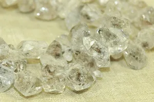 Strand of heavily "Termilated" Quartz rough cut beads