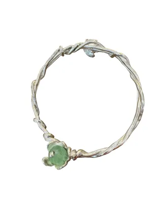Twisted silver bangle with flower charms